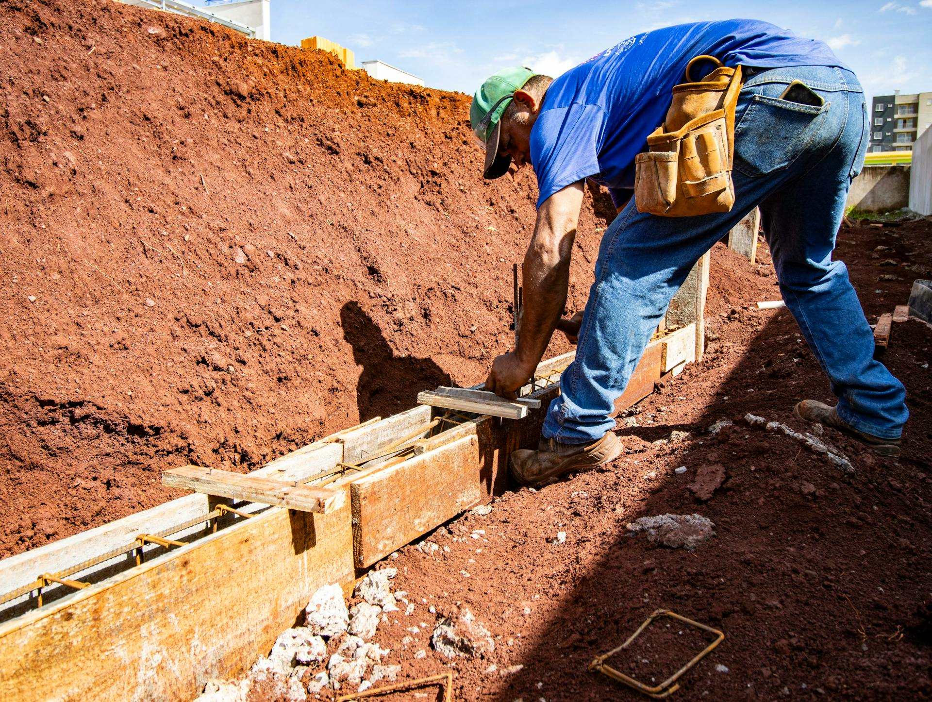 Foundation repair crew installing piers on a Murfreesboro home